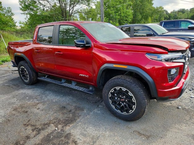 2026 GMC Canyon AT4 in Burgundy - Front Three-Quarter View - BidGoDrive Inventory