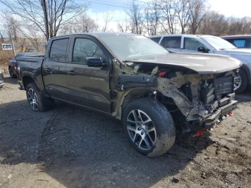 2024 chevrolet colorado Z71 in Brown - Front Three-Quarter View - BidGoDrive Inventory