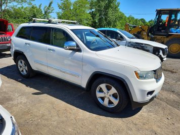 2011 jeep grand-cherokee OVERLAND in White - Front Three-Quarter View - BidGoDrive Inventory