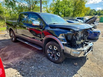 2024 nissan titan PLATINUM RESERVE in Black - Front Three-Quarter View - BidGoDrive Inventory