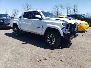2023 Toyota Tacoma Double Cab in White - Front Three-Quarter View - BidGoDrive Inventory